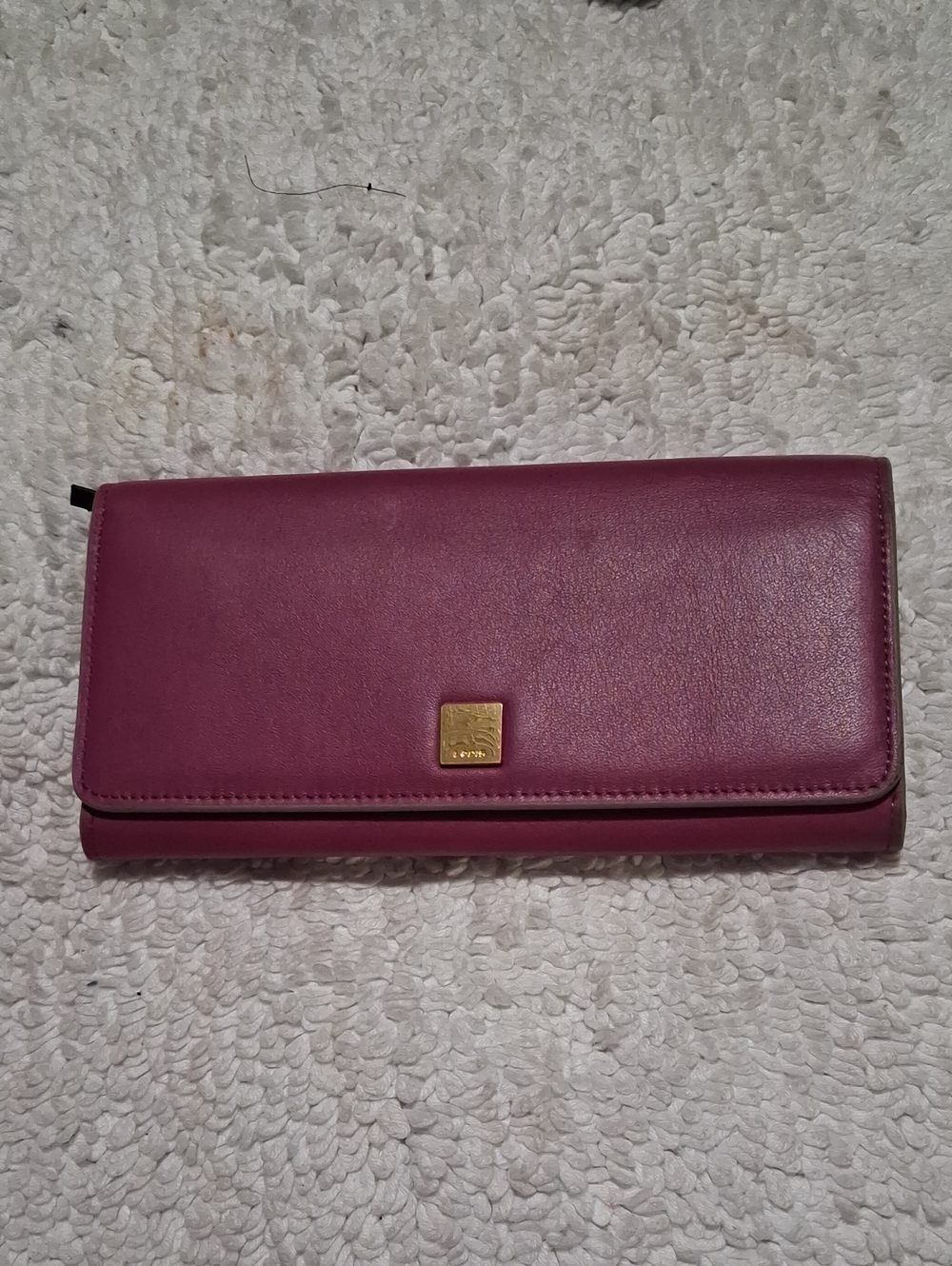 Lodis Plum Leather Continental Wallet with Gold Plaque